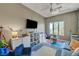 Bright playroom featuring recessed lights, a ceiling fan, large window and comfortable seating at 2111 Bogart Ct, Las Vegas, NV 89117