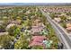 An aerial view of a large house with a pool and a nice yard at 2225 Versailles Ct, Henderson, NV 89074