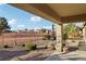 Covered patio overlooks a landscaped backyard with gravel and desert plants at 3455 Halter Dr, Las Vegas, NV 89122