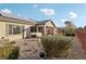 Landscaped backyard with gravel, solar panels, and patio at 3455 Halter Dr, Las Vegas, NV 89122