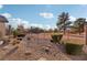 Landscaped backyard with gravel, desert plants, and a metal fence at 3455 Halter Dr, Las Vegas, NV 89122