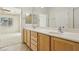 Double sink bathroom with a view into a bedroom at 3455 Halter Dr, Las Vegas, NV 89122