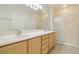 Double sink bathroom with shower and large mirror at 3455 Halter Dr, Las Vegas, NV 89122