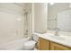 Clean bathroom, shower bathtub combo, and wood vanity at 3455 Halter Dr, Las Vegas, NV 89122