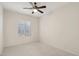 Bright bedroom with ceiling fan and neutral colored carpet at 3455 Halter Dr, Las Vegas, NV 89122