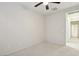 Spacious bedroom with ceiling fan and access to hallway at 3455 Halter Dr, Las Vegas, NV 89122