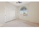 Bright bedroom with double door closet and arched stained glass window at 3455 Halter Dr, Las Vegas, NV 89122