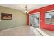 Dining room with green and red walls and sliding glass door at 3455 Halter Dr, Las Vegas, NV 89122
