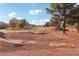 View of a golf course with fairways and mature trees at 3455 Halter Dr, Las Vegas, NV 89122