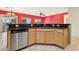 Kitchen with light wood cabinets, granite countertops, and stainless steel dishwasher at 3455 Halter Dr, Las Vegas, NV 89122