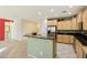 Kitchen with light wood cabinets and a breakfast bar at 3455 Halter Dr, Las Vegas, NV 89122