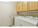 Laundry room with washer, dryer, and cabinets at 3455 Halter Dr, Las Vegas, NV 89122