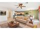 Spacious living room with neutral colored couch and kitchen view at 3455 Halter Dr, Las Vegas, NV 89122