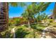 Large backyard featuring mature trees, a well-maintained lawn, and a decorative border, providing ample space at 3709 Citrus Heights Ave, North Las Vegas, NV 89081