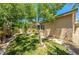 Lush backyard showcasing a vibrant lawn, mature trees, and landscaping, providing a serene and private outdoor space at 3709 Citrus Heights Ave, North Las Vegas, NV 89081
