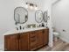 Bathroom features double sinks, wood cabinets, and modern fixtures at 3709 Citrus Heights Ave, North Las Vegas, NV 89081