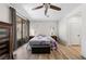 Bright bedroom with a sliding glass door to the backyard and wood look floors at 3709 Citrus Heights Ave, North Las Vegas, NV 89081