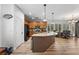 Bright kitchen with a central island that offers seating and counter space, blending style and functionality at 3709 Citrus Heights Ave, North Las Vegas, NV 89081