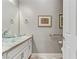 Bathroom featuring vessel sinks, granite countertops, and neutral paint at 480 Heritage Bridge Ave, Henderson, NV 89011