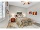 Bedroom features neutral paint, a ceiling fan, and a decorative rug at 480 Heritage Bridge Ave, Henderson, NV 89011