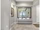 Elegant entryway with stained glass feature and bench at 480 Heritage Bridge Ave, Henderson, NV 89011