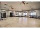 Bright exercise room with hardwood floors, boxing equipment, stationary bikes, and large windows at 480 Heritage Bridge Ave, Henderson, NV 89011