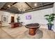 Community game room with two poker tables and a large TV at 480 Heritage Bridge Ave, Henderson, NV 89011