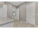 Hallway featuring light tile, granite countertops and white cabinets visible in background at 480 Heritage Bridge Ave, Henderson, NV 89011