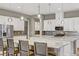 Spacious kitchen features a large island, stainless steel appliances, and modern pendant lighting at 480 Heritage Bridge Ave, Henderson, NV 89011