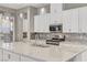 Modern kitchen features granite countertops and stainless steel appliances at 480 Heritage Bridge Ave, Henderson, NV 89011