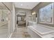 This main bathroom features double sinks, a tub, and a separate shower at 480 Heritage Bridge Ave, Henderson, NV 89011