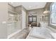This main bathroom features double sinks, a tub, and a separate shower at 480 Heritage Bridge Ave, Henderson, NV 89011