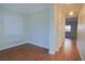 Home office featuring wood floors and built-in shelving at 6740 Silent Vista Way, Las Vegas, NV 89122