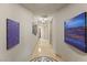 Long hallway with decorative tile and artwork on the walls at 9101 Alta Dr # 307, Las Vegas, NV 89145