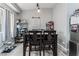 Casual dining area with dark wood table and chairs at 10429 Loma Portal Ave, Las Vegas, NV 89166