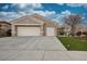 Two-car garage home with landscaping and driveway at 10612 Back Plains Dr, Las Vegas, NV 89134