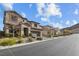 Two-story homes with attached garages and landscaping at 12730 Coastline Shadow St, Las Vegas, NV 89141