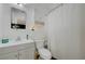 Clean bathroom featuring a vanity, mirrored cabinet, and a shower with a curtain at 155 E Van Wagenen St, Henderson, NV 89015