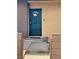 Inviting home entrance with security door, walkway and attractive landscaping at 155 E Van Wagenen St, Henderson, NV 89015