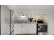 Well-lit kitchen with stainless steel appliances and bright white cabinets at 155 E Van Wagenen St, Henderson, NV 89015