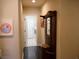 Hallway with coat rack and access to laundry room at 1609 Hidden Spring Dr, Las Vegas, NV 89117