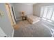 Bright bedroom with carpeted floors and large window at 1849 Indian Bend Dr, Henderson, NV 89074
