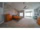 Bright and airy bedroom with a cozy bed, wood-like accent wall, and fireplace at 1849 Indian Bend Dr, Henderson, NV 89074