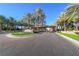 Grand Legacy community entrance with palm trees and brick driveway at 1849 Indian Bend Dr, Henderson, NV 89074