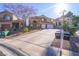 Two-story home with driveway and landscaping at 1849 Indian Bend Dr, Henderson, NV 89074