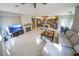 Spacious living room with marble floors and a fireplace, open to kitchen at 1849 Indian Bend Dr, Henderson, NV 89074