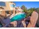 Relaxing pool area with a rock waterfall feature at 1849 Indian Bend Dr, Henderson, NV 89074