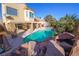 Inviting kidney-shaped pool with rock waterfall feature at 1849 Indian Bend Dr, Henderson, NV 89074