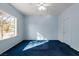 Blue bedroom with a ceiling fan and dark blue carpet at 2185 Indigo Creek Ave, Henderson, NV 89012