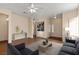 Virtually staged living room featuring modern furniture and decor at 2185 Indigo Creek Ave, Henderson, NV 89012